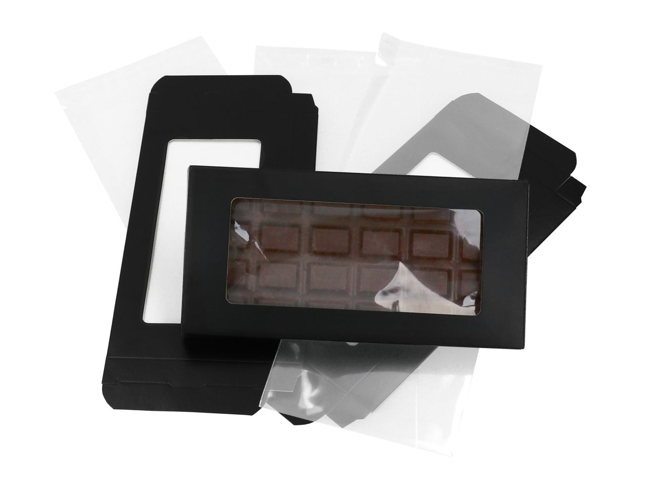18247_B82470 Präsentschachtel für Schokoladentafeln im 3er Pack. Ein Ausschnitt auf der Vorderseite gibt den Blick frei auf Ihre Schokoladentafel. Zum hygienischen Einpacken liegen 3 Zellglasbeutel mit Klebestreifen bei. Maße der Schokoladenverpackung: 160x80x15mm M